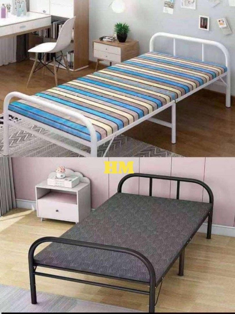 Folding Bed (Category: Bed Frames & Mattresses) located in Manila. Submitted by jelai.cybyb (Listing ID 1426875427, Image 3). Description: Folding bed features a mattress with a striped pattern. It has a white metal frame. The bed can be folded for easy storage. It is suitable for guest rooms or small spaces. The bed is designed for comfort and convenience..