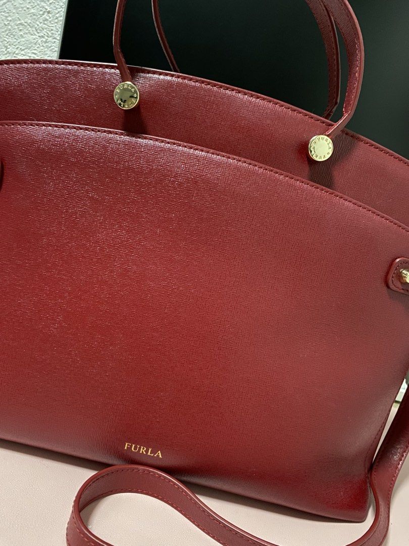 Furla Red Handbag with Shoulder Strap (Category: Luxury Bags & Wallets) located in Angeles City. Submitted by kinadi051390 (Listing ID 1426943885, Image 2). Description: .