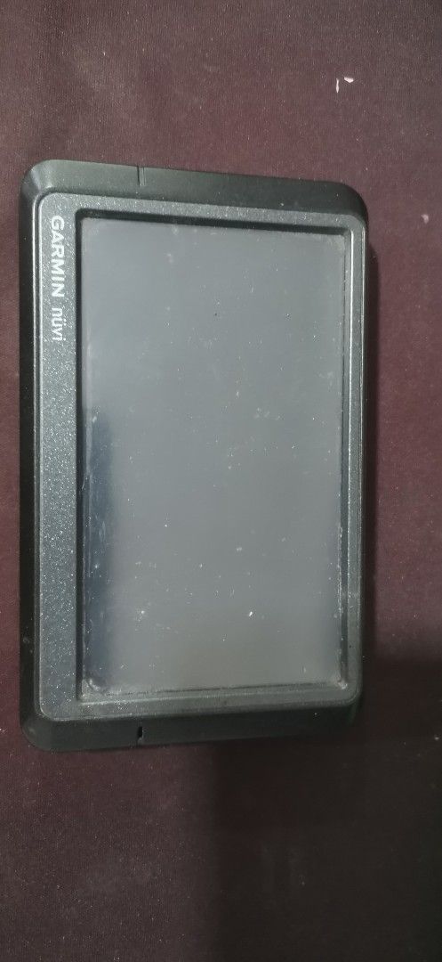 Garmin nuvi 255W GPS Navigator (Category: Wearables & Smart Watches) located in General Santos City (Dadiangas). Submitted by sam_surplus (Listing ID 1426889780, Image 1). Description: Garmin nuvi 255W GPS navigator. Features a screen and a textured back with the Garmin logo. The side shows the model number and other details. Includes a mini-USB port. bought from surplus.. i dont know if its working or not.