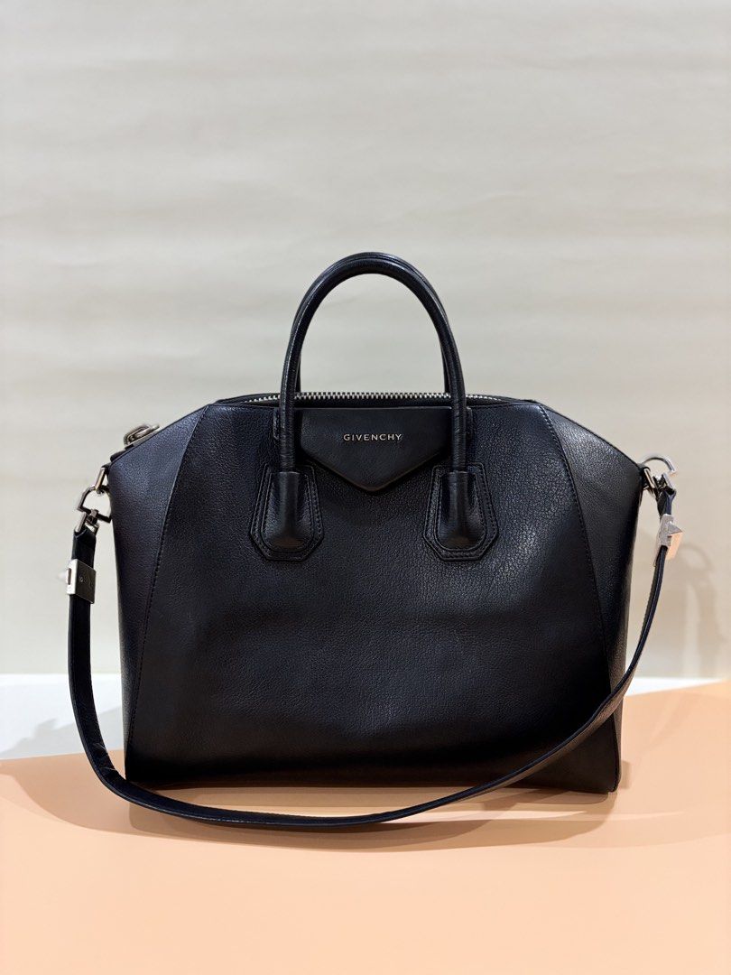 Givenchy Antigona Handbag (Category: Luxury Bags & Wallets) located in Muntinlupa City. Submitted by closet.confessions (Listing ID 1426931571, Image 2). Description: A true fashion classic — the Givenchy Medium Antigona. ▪️ Structured luxury classic, iconic! ▪️ Spacious everyday size. Can fit laptop. ▪️ Unisex design – perfect for men & women Medium in goatskin SHW ‼️Rank A (has a small hole inside, does not compromise the bag’s structure & usab