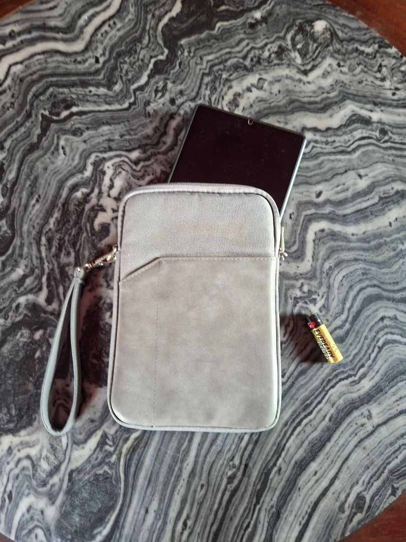 Gray Tablet Sleeve with Wrist Strap (Category: Cases & Sleeves) located in Taguig. Submitted by d_man11 (Listing ID 1426800716, Image 1). Description: - Barely used Tablet Sleeve Bag - Fits up to 8 inch tablets - Soft cushioned pouch for tablet - 1 External pocket - Wrist strap for easy carrying - pre loved, used but not abused - water resistant Dimensions: 9 x 6.25 inches.