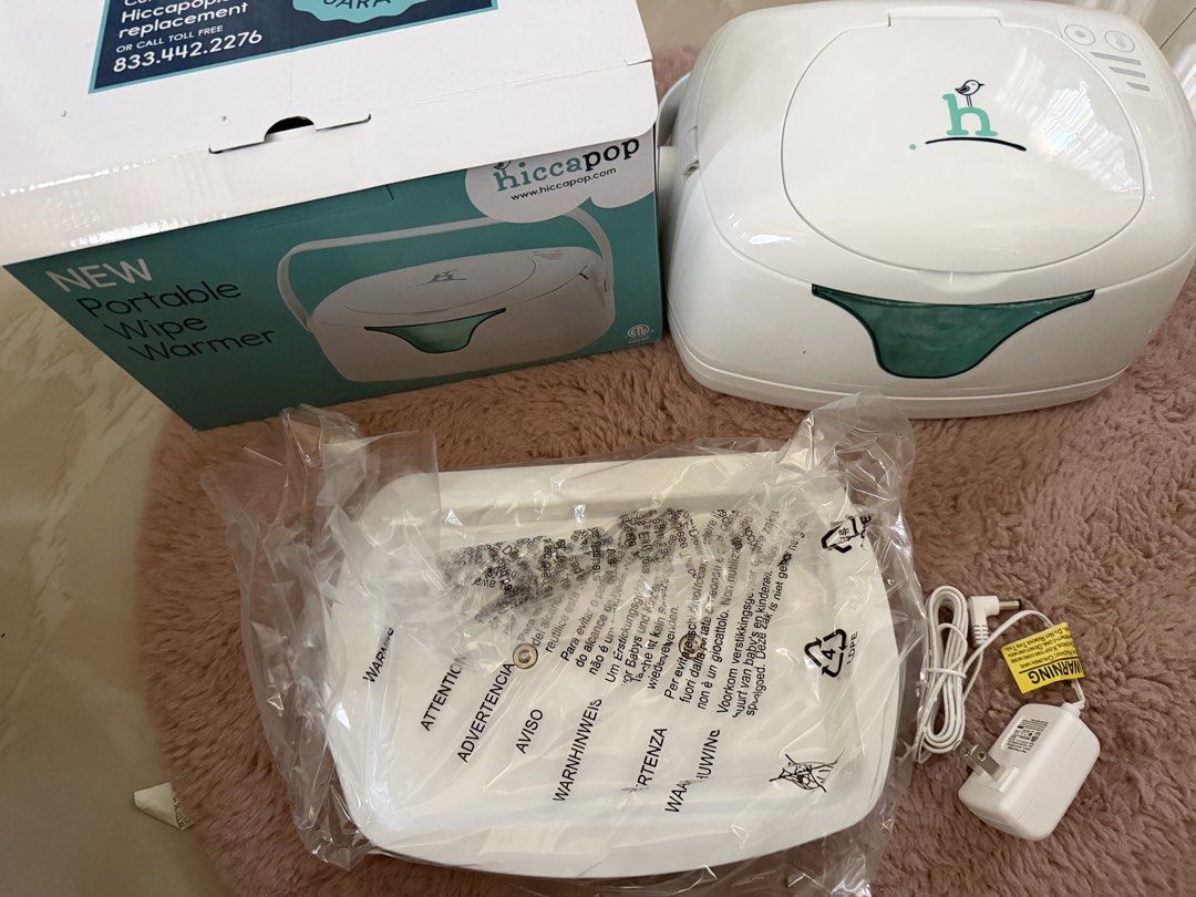 Hiccapop Portable Wipe Warmer (Category: Baby Toiletries & Grooming) located in Makati City. Submitted by marowebg (Listing ID 1426860061, Image 2). Description: Complete with box. Almost new and some unused items..