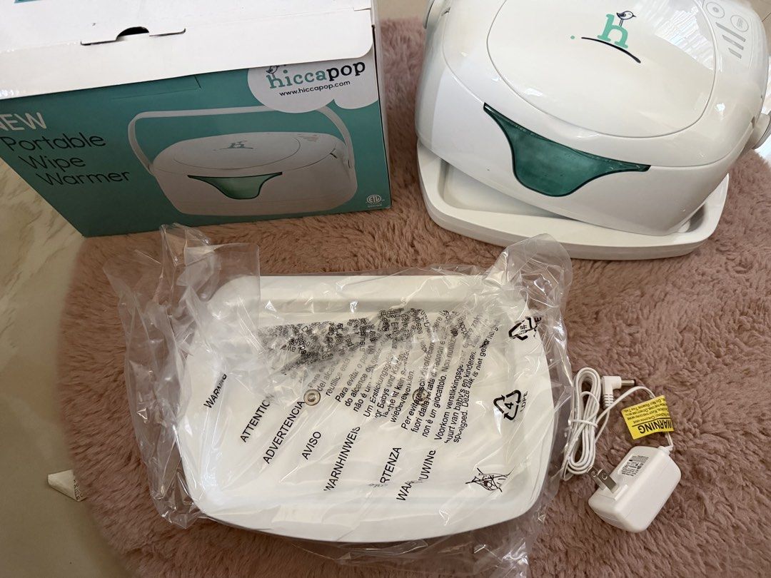Hiccapop Portable Wipe Warmer (Category: Baby Toiletries & Grooming) located in Makati City. Submitted by marowebg (Listing ID 1426860061, Image 1). Description: Complete with box. Almost new and some unused items..
