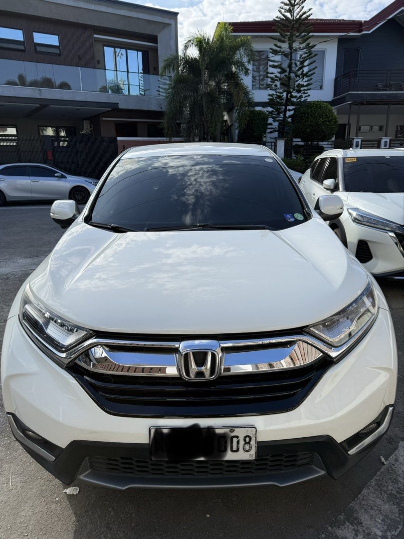 Honda CR-V 2.0 (A) (Category: Used Cars) located in Quezon City. Submitted by ramreyes31 (Listing ID 1426905220, Image 1). Description: Honda CRV 2018 Model Bought December 2017 5-Seater Gas Automatic Pearl White Well maintained and driven daily Mileage: 98k km Clean title No major accidents All maintenance and repairs done in casa Issues: Dashboard warning on tire pressure. Must be sensor only. One of the rear tail lights not working. May need r