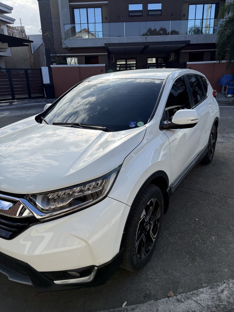 Honda CR-V 2.0 (A) (Category: Used Cars) located in Quezon City. Submitted by ramreyes31 (Listing ID 1426905220, Image 2). Description: Honda CRV 2018 Model Bought December 2017 5-Seater Gas Automatic Pearl White Well maintained and driven daily Mileage: 98k km Clean title No major accidents All maintenance and repairs done in casa Issues: Dashboard warning on tire pressure. Must be sensor only. One of the rear tail lights not working. May need r