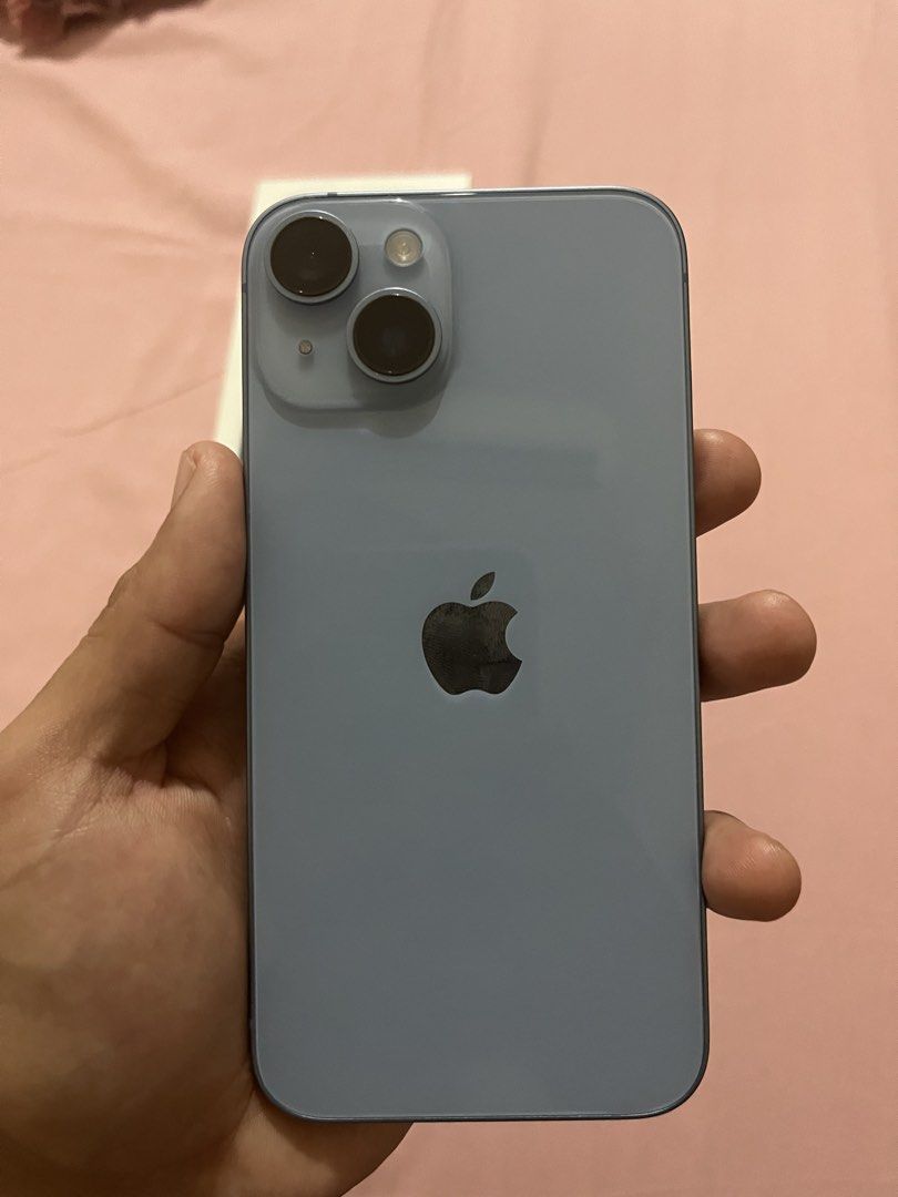 Iphone 14 (Category: iPhone 14 Series) located in Manila. Submitted by vincen_desales (Listing ID 1426913523, Image 3). Description: iPhone 14 128GB – Blue • Storage - 128GB • Color - Blue • Battery Health - 87% • Condition - used (good condition) • Issue - small scratch on the corner of the back camera (cosmetic only, no effect on performance) Inclusions: • Unit • Original box • SIM ejector pin • Screen protector (already installed) No charger/c