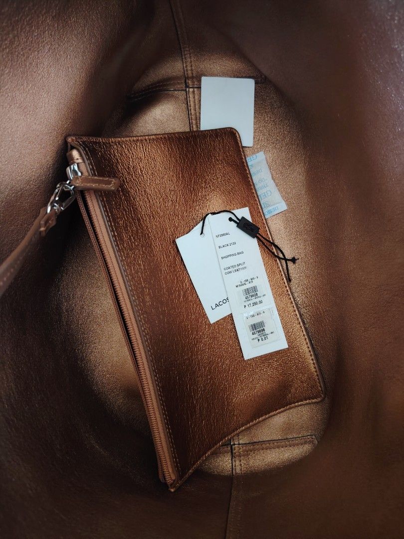 Lacoste Tote bag (Category: Shoulder Bags) located in Mandaluyong City. Submitted by pinkcel (Listing ID 1426831832, Image 3). Description: Reversible Cow leather Flaw - Signs of usage.
