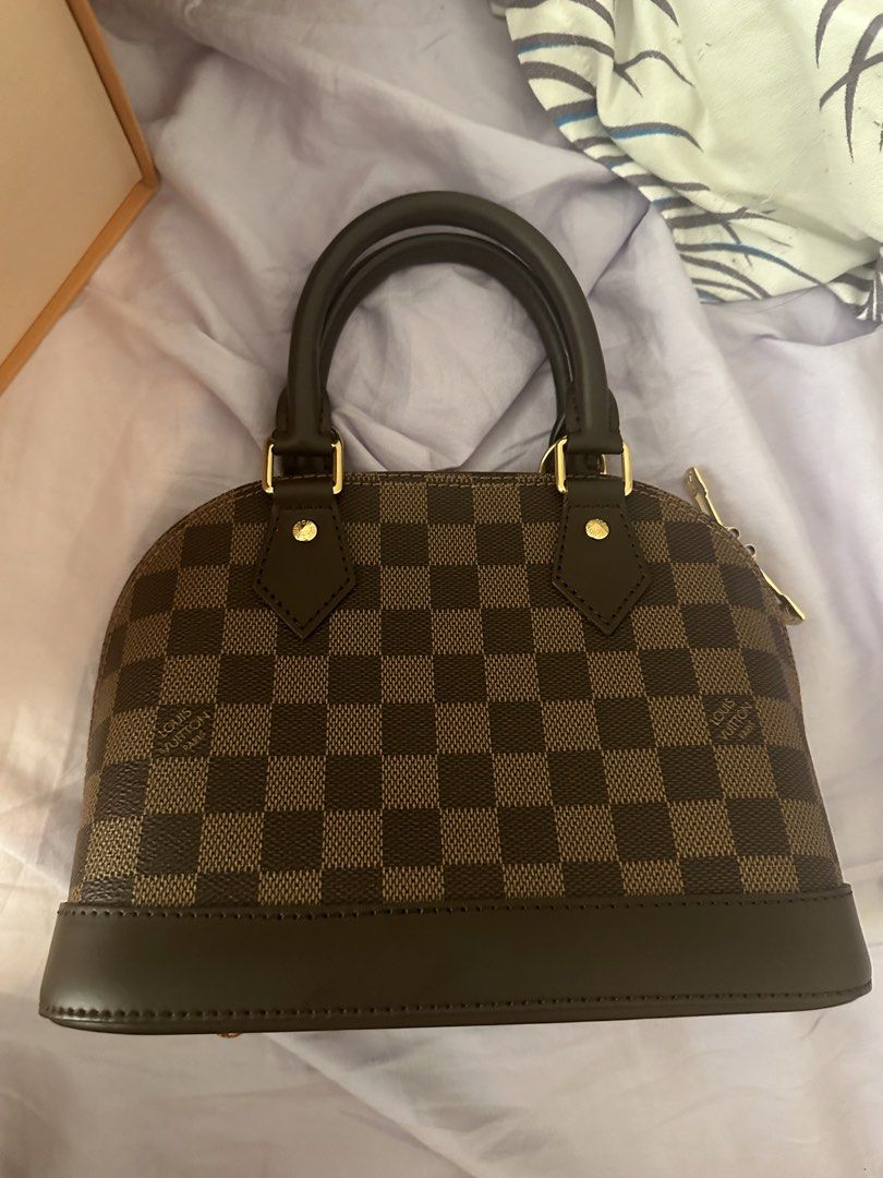 Louis Vuitton Alma BB Damier Ebene (Category: Luxury Bags & Wallets) located in Makati City. Submitted by danielleanthea (Listing ID 1426881054, Image 1). Description: Only used once. GUARANTEED ORIGINAL BOUGHT IN BARCELONA, SPAIN NO ISSUES, NO SCRATCHES COMPLETE WITH BOX RFS: NEED FUNDS MEET-UP ONLY LOC BACOOR CAVITE NEGOTIABLE IF BUY ASAP.