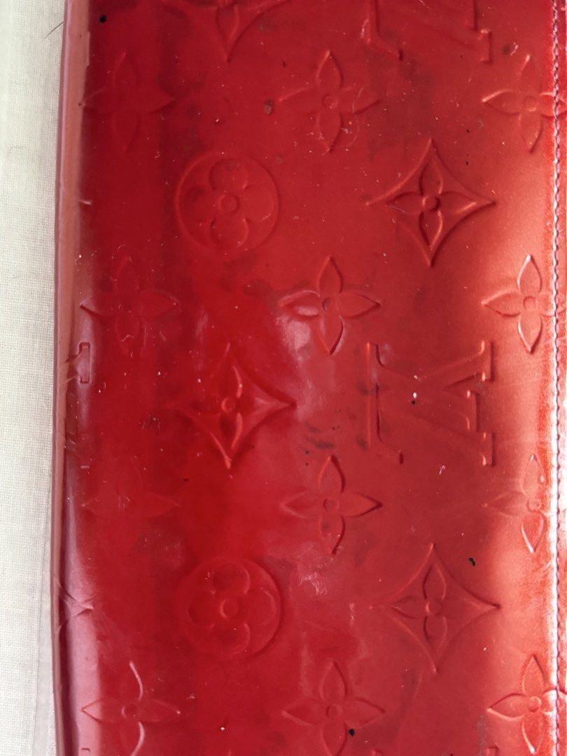 Louis Vuitton Vernis Zippy Wallet (Category: Luxury Bags & Wallets) located in Quezon City. Submitted by marymae1223 (Listing ID 1426811869, Image 2). Description: Authentic Louis Vuitton Zippy Wallet in red vernis leather. Features the iconic LV monogram pattern. The wallet has a zip-around closure and a gold-tone zipper. The interior includes multiple card slots, compartments, and a zippered coin pocket. Includes a receipt from Citibank bought 