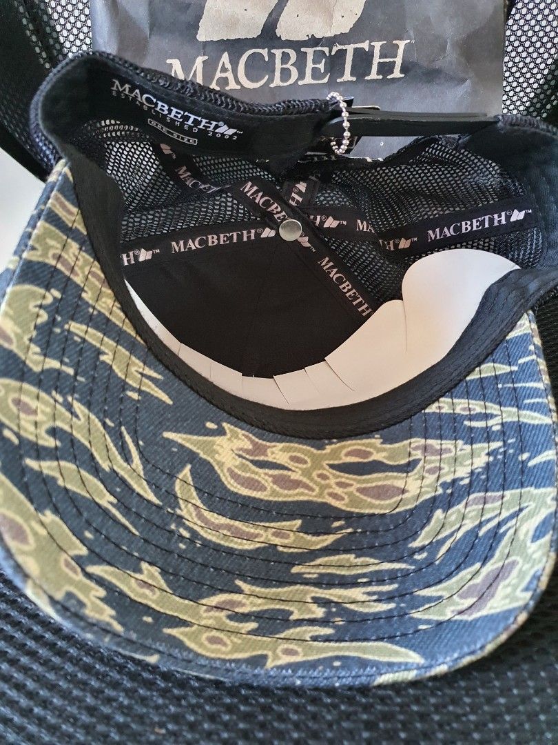 Macbeth Camo Trucker Cap (Category: Caps & Hats) located in Meycauayan. Submitted by shoptoown (Listing ID 1426878776, Image 3). Description: Macbeth cap features a unique camo pattern. It has a mesh back for breathability and an adjustable snapback closure. The Macbeth logo is visible on the side and inside the cap..