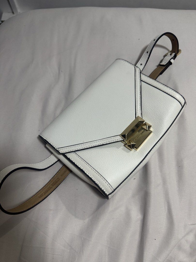 Michael Kors White Leather Belt Bag (Category: Luxury Bags & Wallets) located in Manila. Submitted by dejunk.mnl (Listing ID 1426936643, Image 1). Description: - Michael Kors Belt Bag - White leather - Small size - Crossbody style - Gold hardware - Stylish and practical - Authentic Belt Bag Carry your essentials in hands-free style with MICHAEL Michael Kors’ super-chic leather belt bag, in an envelope silhouette accented with glimmering gold-tone