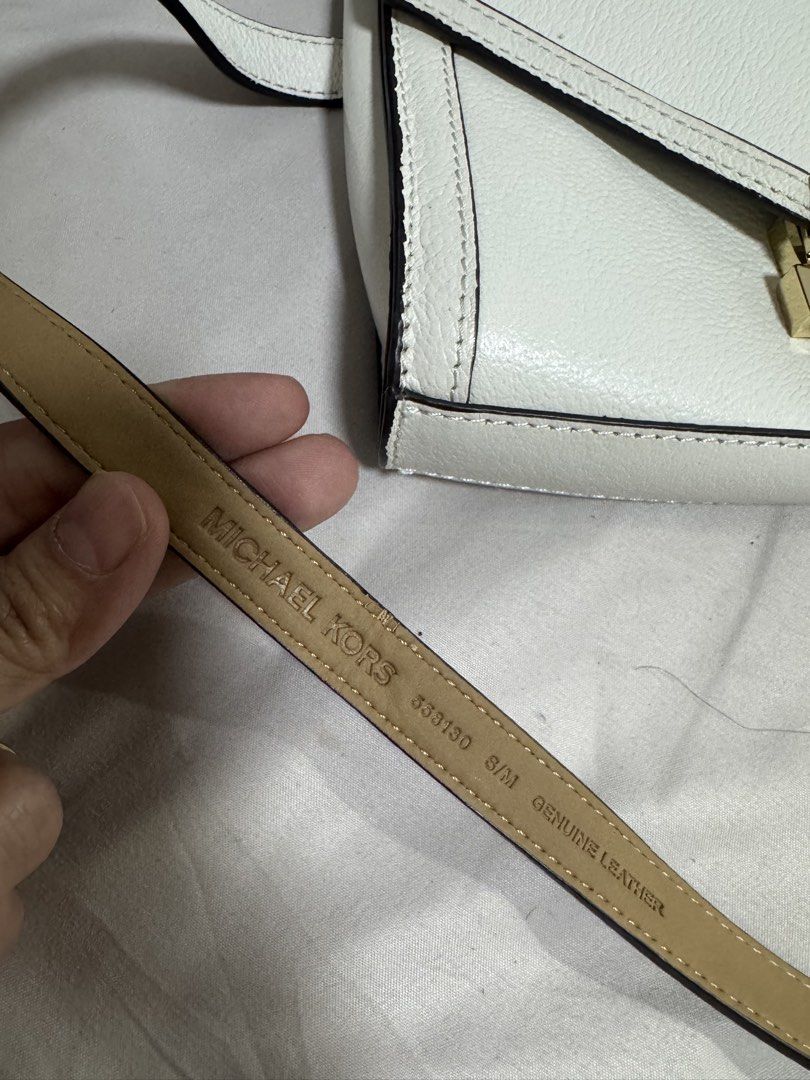 Michael Kors White Leather Belt Bag (Category: Luxury Bags & Wallets) located in Manila. Submitted by dejunk.mnl (Listing ID 1426936643, Image 3). Description: - Michael Kors Belt Bag - White leather - Small size - Crossbody style - Gold hardware - Stylish and practical - Authentic Belt Bag Carry your essentials in hands-free style with MICHAEL Michael Kors’ super-chic leather belt bag, in an envelope silhouette accented with glimmering gold-tone
