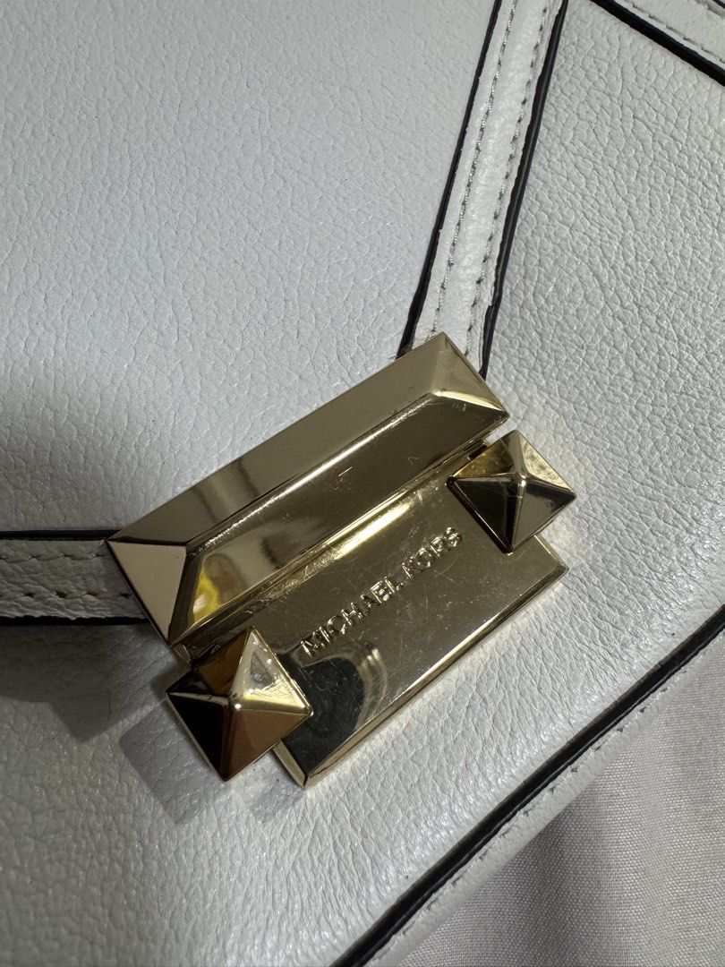 Michael Kors White Leather Belt Bag (Category: Luxury Bags & Wallets) located in Manila. Submitted by dejunk.mnl (Listing ID 1426936643, Image 2). Description: - Michael Kors Belt Bag - White leather - Small size - Crossbody style - Gold hardware - Stylish and practical - Authentic Belt Bag Carry your essentials in hands-free style with MICHAEL Michael Kors’ super-chic leather belt bag, in an envelope silhouette accented with glimmering gold-tone