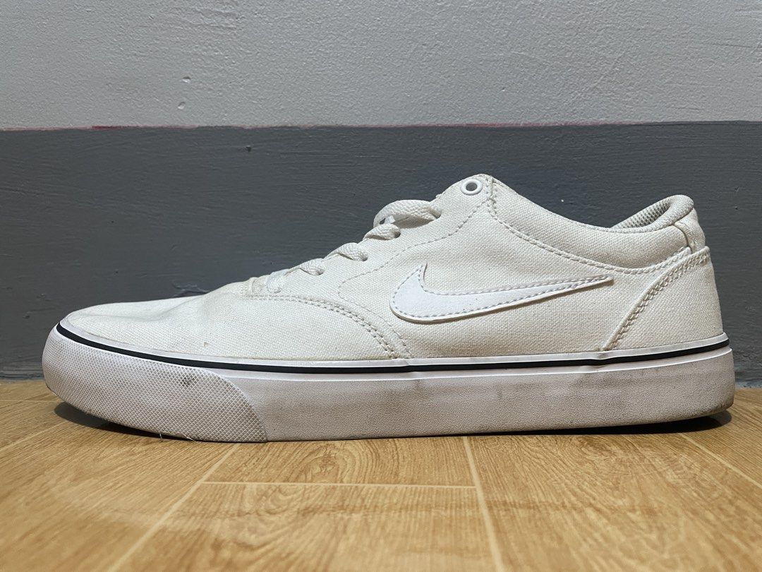 Nike SB Charge Canvas White Sneakers (Category: Sneakers) located in Manila. Submitted by phenommae (Listing ID 1426792648, Image 1). Description: Nike SB Chron 2 Canvas (White) – US 10 Used but not abused. Pasalubong from abroad, natambak lang. Still in good condition, just needs cleaning..
