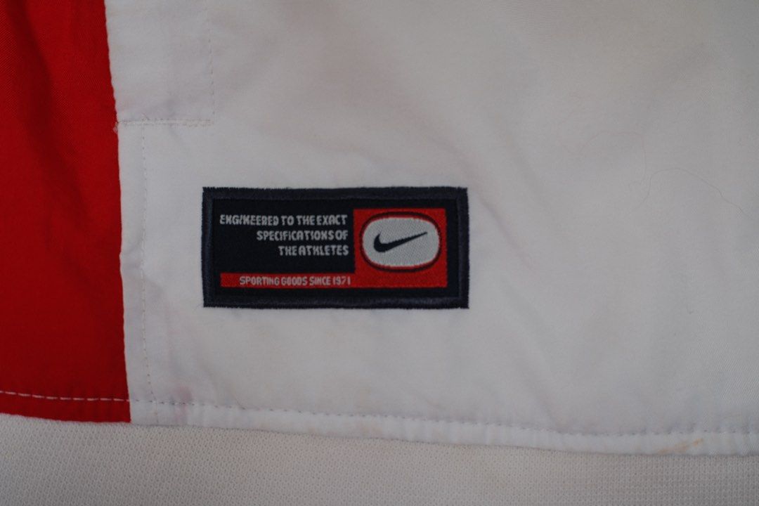 Nike Vintage Windbreaker Jacket Y2K Red White Blue (Category: Coats, Jackets and Outerwear) located in San Pablo. Submitted by chimar26 (Listing ID 1426891621, Image 2). Description: Authentic Nike vintage windbreaker jacket in classic red, white and navy colorway. Very clean sporty design with embroidered Nike logo on the front and large Nike logo on the back. Lightweight and comfortable – perfect for streetwear, vintage outfits or everyday wear