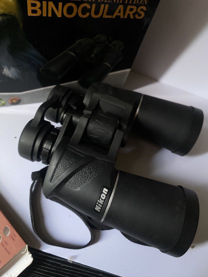 Original Nikon High Denifition Binoculars (Category: Lens & Kits) located in Manila. Submitted by lairx_mari (Listing ID 1426802942, Image 2). Description: High-quality Nikon binoculars. Features High Denifition and German Lens Technology. Comes with a carrying strap. The binoculars are black. The box shows an eagle and the binoculars themselves. Perfect for bird watching or outdoor activities..