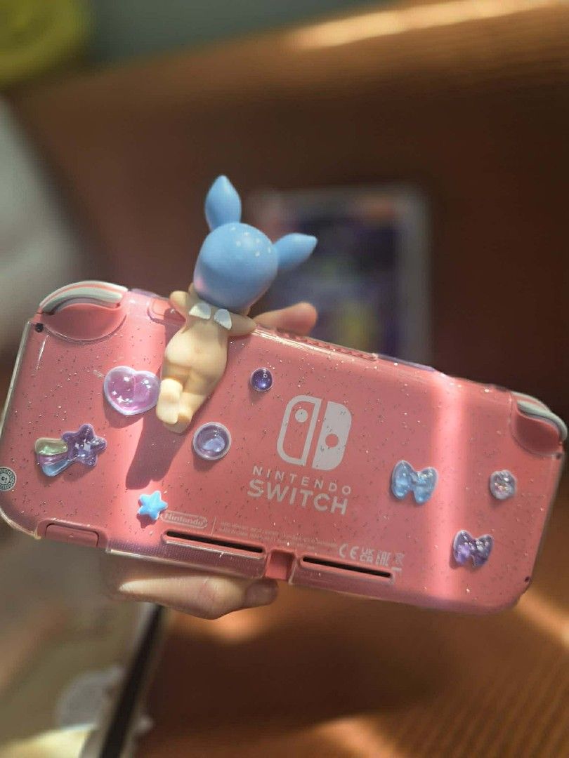 Nintendo Switch Lite (Coral Pink) with Game (Category: Nintendo) located in Manila. Submitted by ppogi203216148 (Listing ID 1426831721, Image 3). Description: For SALE Nintendo Switch Lite (Coral Pink) Inclusions: - Orig Charger - 2 Tempered Glass - Case - Cosmic Shake Game Mandaluyong/Valenzuela weekdays Antipolo weekends.
