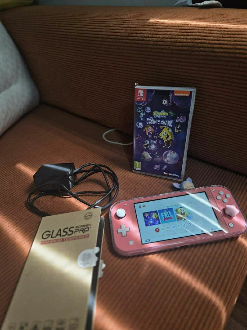 Nintendo Switch Lite (Coral Pink) with Game (Category: Nintendo) located in Manila. Submitted by ppogi203216148 (Listing ID 1426831721, Image 1). Description: For SALE Nintendo Switch Lite (Coral Pink) Inclusions: - Orig Charger - 2 Tempered Glass - Case - Cosmic Shake Game Mandaluyong/Valenzuela weekdays Antipolo weekends.