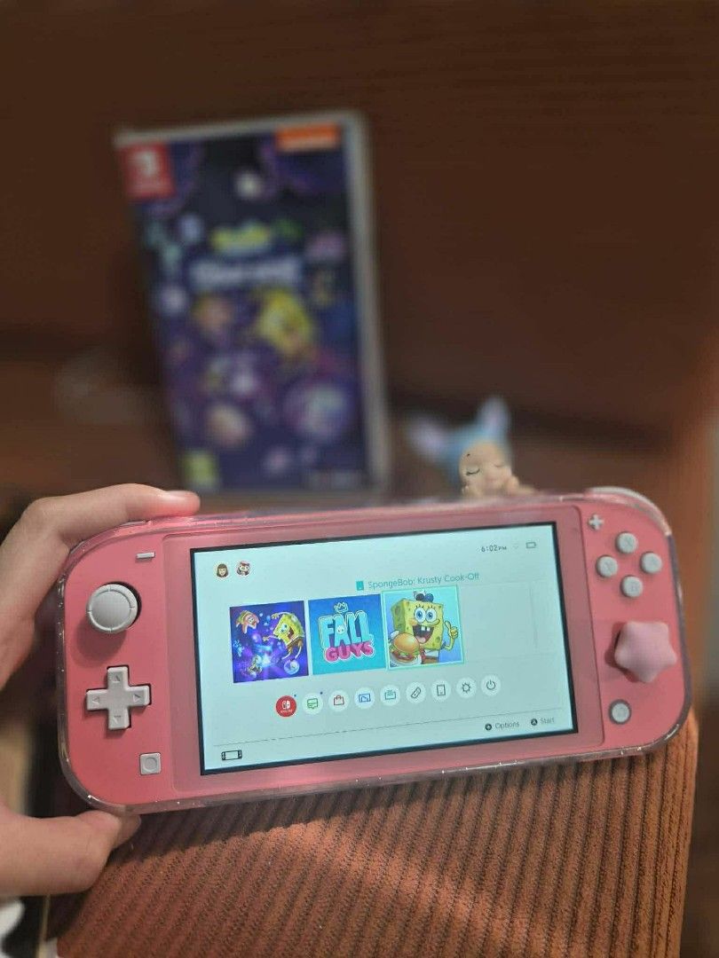 Nintendo Switch Lite (Coral Pink) with Game (Category: Nintendo) located in Manila. Submitted by ppogi203216148 (Listing ID 1426831721, Image 2). Description: For SALE Nintendo Switch Lite (Coral Pink) Inclusions: - Orig Charger - 2 Tempered Glass - Case - Cosmic Shake Game Mandaluyong/Valenzuela weekdays Antipolo weekends.
