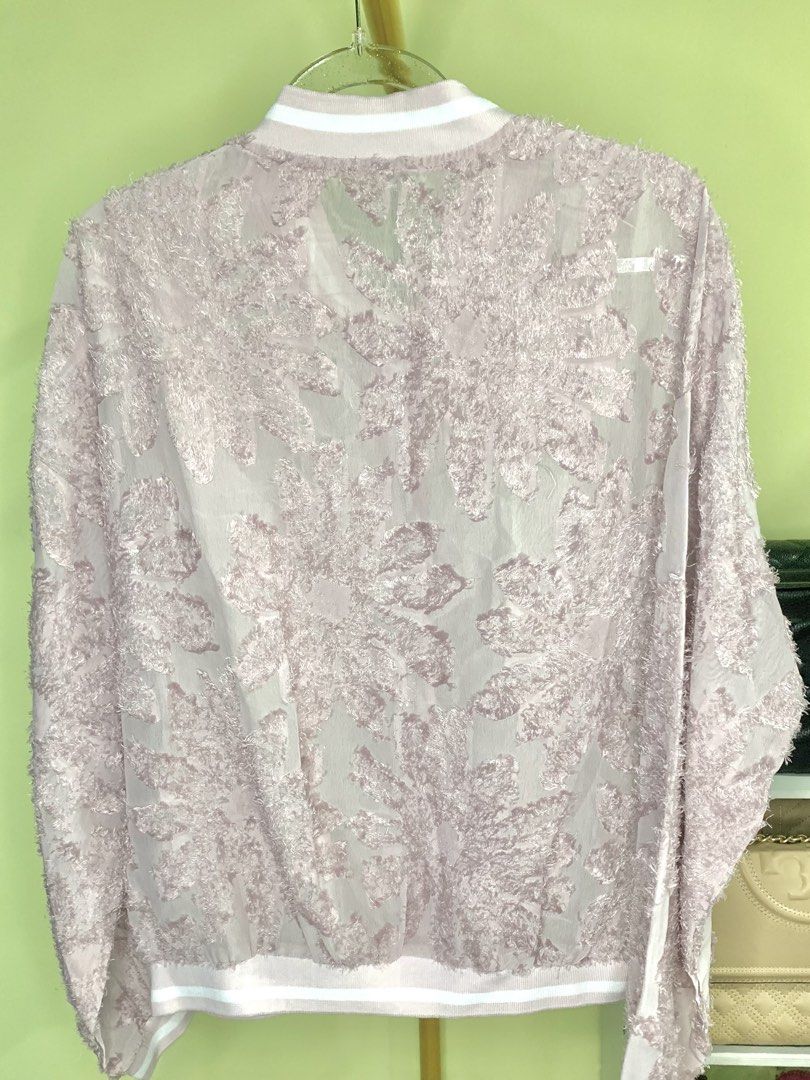 Pink Floral Bomber Jacket (Category: Coats, Jackets and Outerwear) located in Manila. Submitted by amethyste_ph (Listing ID 1426945868, Image 2). Description: - Pink bomber jacket - Unique floral design - Zip-up front with ring pull - Ribbed collar, cuffs, and hem with white stripes - Sheer, textured fabric - Long sleeves - Relaxed fit.