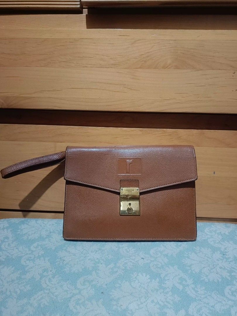 Renoma Clutch Bag (Category: Belt bags, Clutches and Pouches) located in Baguio. Submitted by roselleshiddentreasures13384 (Listing ID 1426834052, Image 1). Description: - Renoma Clutch Bag - Brown color - Textured finish - Gold clasp - Wrist strap - Stylish and functional.