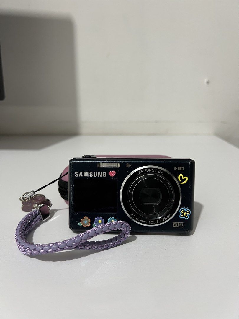 Samsung DV150F digital camera midnight blue (Category: Cameras) located in Quezon City. Submitted by potatofinds (Listing ID 1426838989, Image 2). Description: Samsung DV150F digital camera in midnight blue - body condition: 7/10 has scratches - minor issue: gallery button not working but u can still see it sa menu, spots in lcd, slightly hazy output but u can work around it sa settings - inclusion: unit, battery, stickers - Php 2,999 (last price