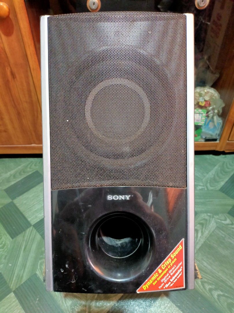 Sony Subwoofer SS-WS85 (Category: Soundbars, Speakers & Amplifiers) located in Imus. Submitted by christian20_ (Listing ID 1426918172, Image 1). Description: 285W 1.5Ω LOW IMPEDANCE DAGUNDONG MALALA NO ISSUE SA PERFORMANCE ISSUE SA APPEARANCE LANG PARA SA MASELAN ISSUE: NASA PIC NA PARA SA MASELAN KAYA REMEDYOHAN NG EPOXY Sony subwoofer with a black and silver design. Features a front-facing speaker and a bass port. The unit has some wear and tea