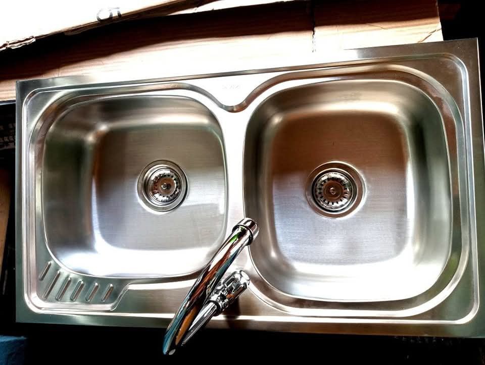 Stainless Steel Double Bowl Kitchen Sink (Category: Bathroom & Kitchen Fixtures) located in Manila. Submitted by muranglababo_ph2026 (Listing ID 1426955852, Image 3). Description: 🛠️ Stainless Double Sink with Faucet – Complete Set! ✨ Bagong-bago, ready to install! 📏 Size: 17 ½ x 31 ½ inches ⬇️ Depth: 6 inches 🚰 Kasama na: faucet at fittings 💰 Presyo: ₱2,200 only! ✅ Matibay at stainless steel – pangmatagalan ✅ Double tub para mas convenient s