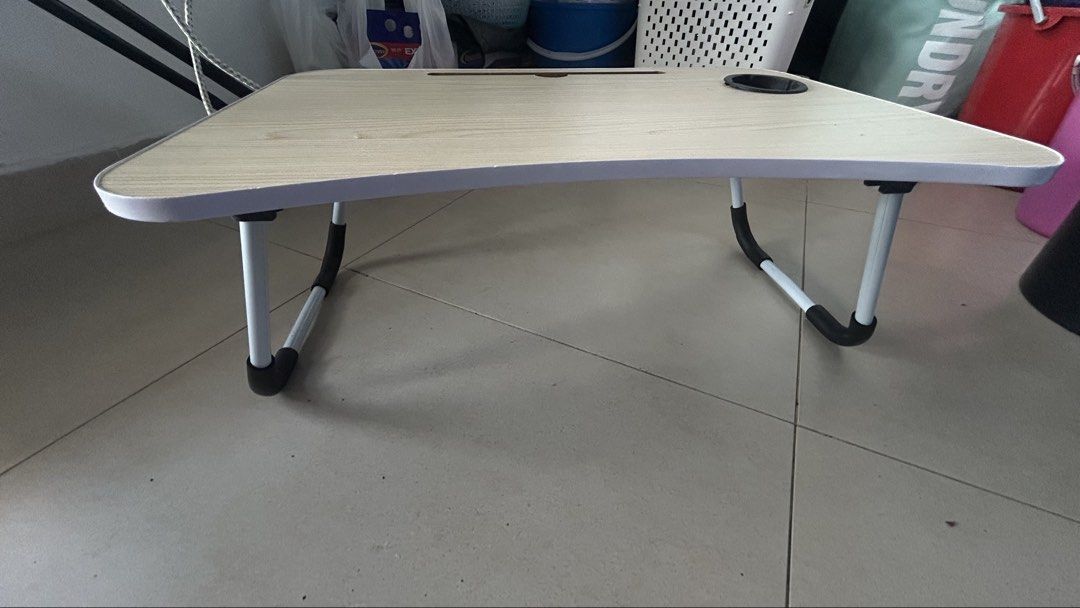 Study table (Category: Tables & Sets) located in Singapore. Submitted by gurungyalm88382 (Listing ID 1426796191, Image 2). Description: Compact Foldable Wooden Desk – Perfect for Small Spaces Upgrade your study or work setup with this portable foldable desk designed for convenience and comfort. Crafted with a light wood-grain finish and sturdy white metal legs, it’s both stylish and practical. ✨ Key Features: Foldable design – easy to store and c