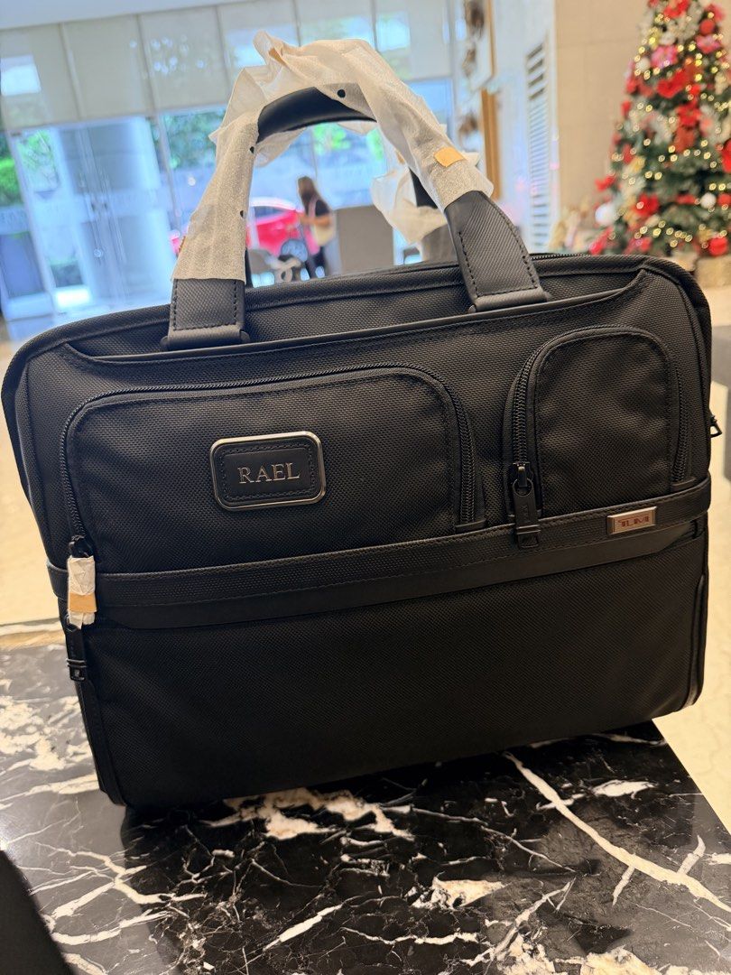 Tumi Alpha Expandable Organizer Laptop Brief (Category: Briefcases) located in Taguig. Submitted by ipremacha (Listing ID 1426921933, Image 2). Description: Tumi Alpha Expandable Organizer Laptop Brief Rfs: Change of mind. Prefers backpack With receipt from tumi greenbelt Srp is 48990 but selling super low price Brandnew and never used Exterior Features: * Zip entry to main compartments * Gusseted front straight-zip pocket * 2 front U-zip pockets