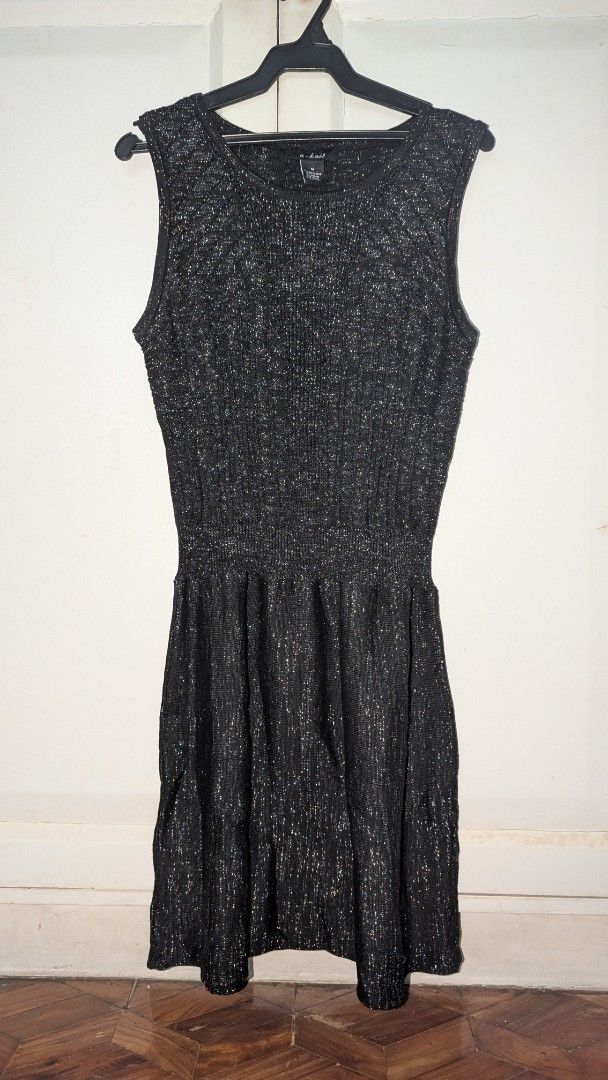 U-Knit Sleeveless Dress - Medium (Category: Dresses) located in Muntinlupa City. Submitted by lsfinds (Listing ID 1426835182, Image 1). Description: Sleeveless dress from U-Knit. Features a textured, glittery fabric. It has a fitted bodice and a flared skirt. The dress is a medium size. It has a round neckline. The dress is black with silver accents. It is new with tags..