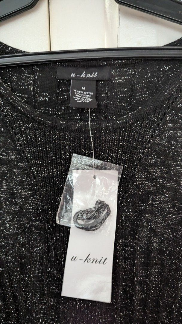 U-Knit Sleeveless Dress - Medium (Category: Dresses) located in Muntinlupa City. Submitted by lsfinds (Listing ID 1426835182, Image 2). Description: Sleeveless dress from U-Knit. Features a textured, glittery fabric. It has a fitted bodice and a flared skirt. The dress is a medium size. It has a round neckline. The dress is black with silver accents. It is new with tags..