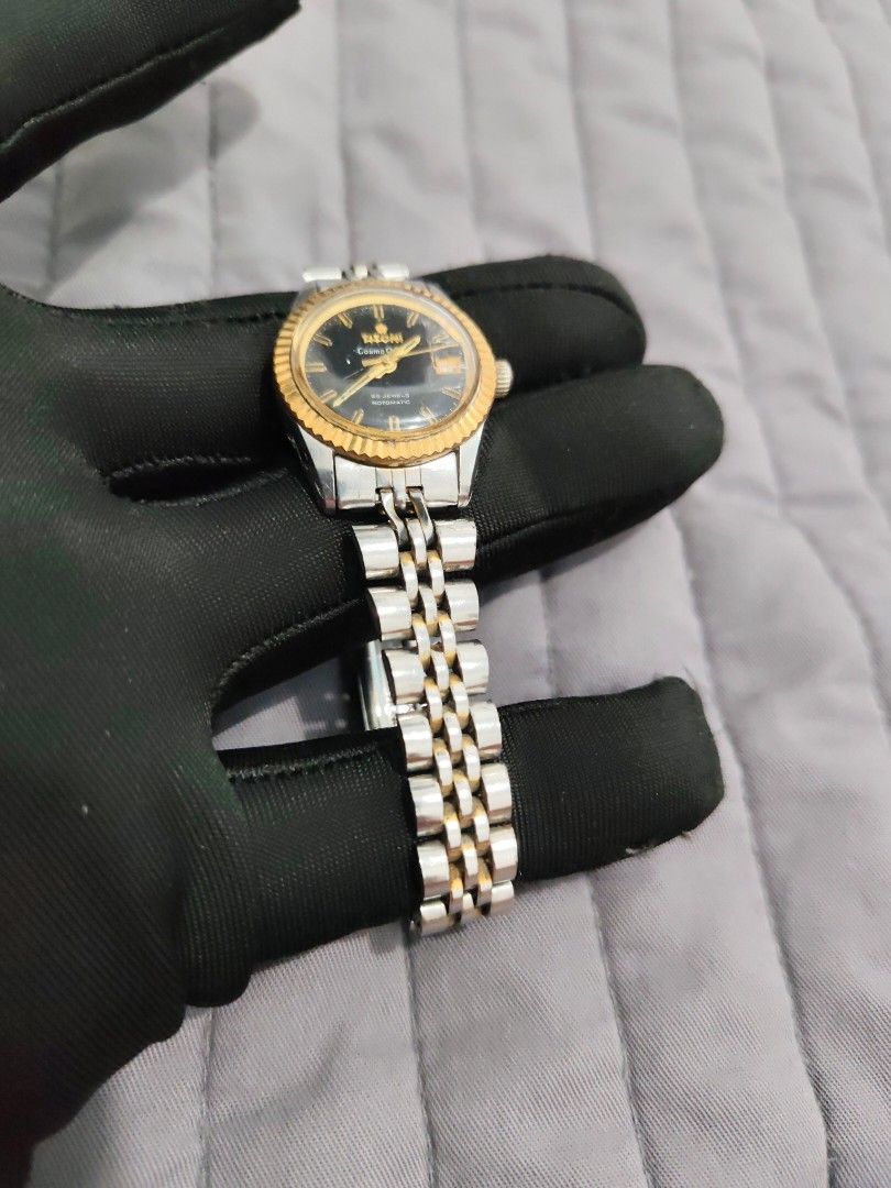 Vintage/Rare Titoni Cosmo Queen Rotomatic (Category: Women's Watches) located in Cebu City. Submitted by aceoftime (Listing ID 1426947211, Image 3). Description: In good working condition Swiss Automatic movt w date window Gold tone fluted bezel in jubilee strap 25 Jewels Swiss Made Our Guarantee: 💯 Authentic All watches are checked by our experienced tech to ensure good functionality Please manage your expectations since these are preloved watc