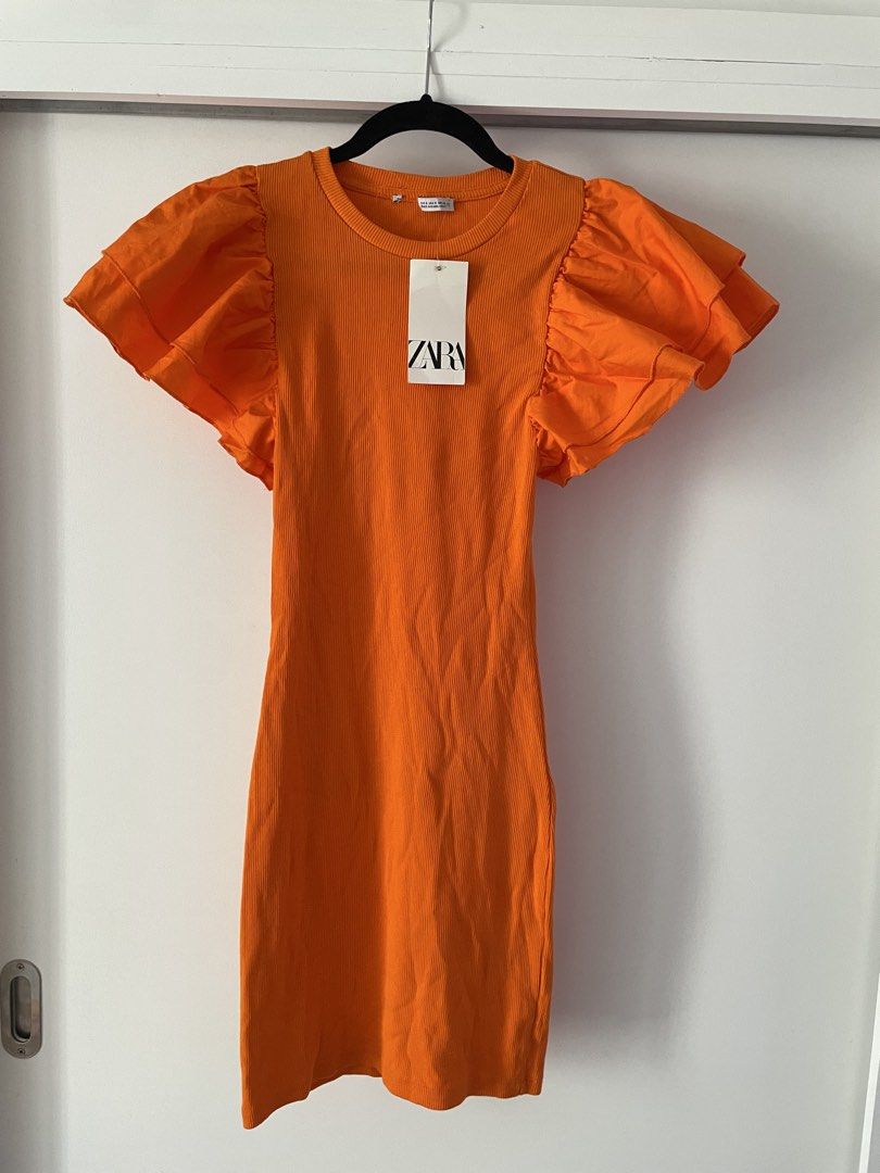 Zara Ruffle Sleeve Mini Dress (Category: Dresses) located in Paranaque City. Submitted by jntspns (Listing ID 1426829989, Image 1). Description: Mini dress features a ribbed bodice and statement ruffle sleeves. It has a round neckline and a fitted silhouette..