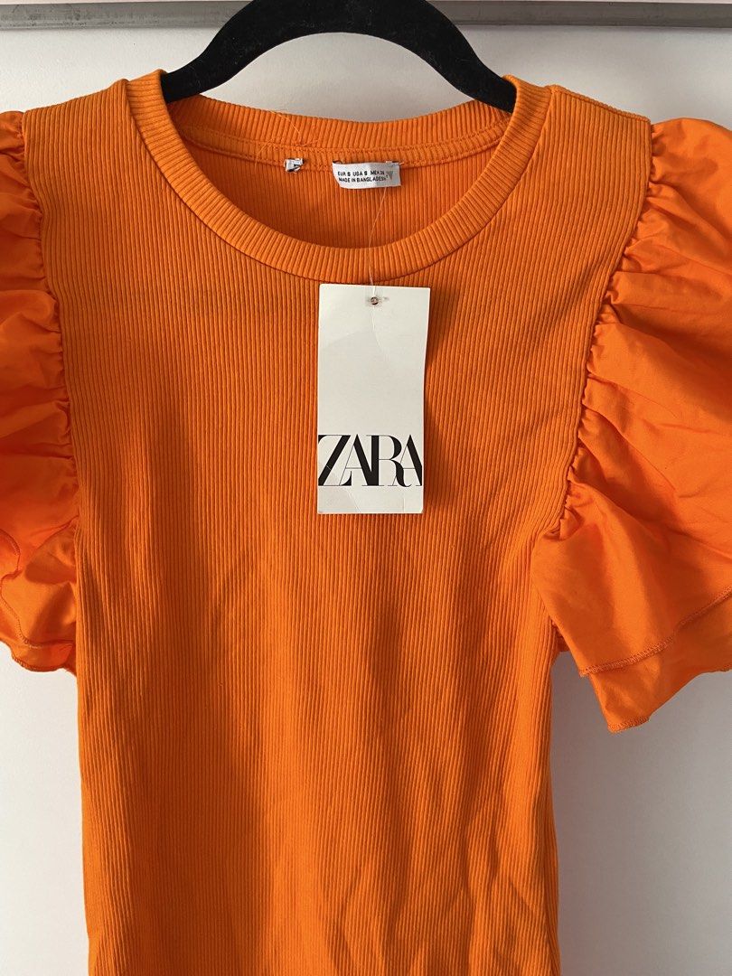 Zara Ruffle Sleeve Mini Dress (Category: Dresses) located in Paranaque City. Submitted by jntspns (Listing ID 1426829989, Image 2). Description: Mini dress features a ribbed bodice and statement ruffle sleeves. It has a round neckline and a fitted silhouette..