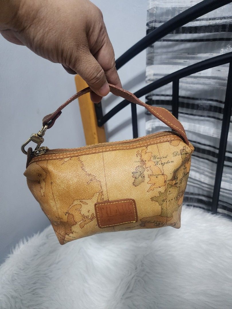 Alviero Martini Prima Classe Handbag (Category: Luxury Bags & Wallets) located in Paranaque City. Submitted by rizasauthenticitems (Listing ID 1427149266, Image 3). Description: Alviero Martini pouch features a classic Geo Map print. Leather handle and zipper closure. The interior is a light brown color. The hardware is gold-toned..