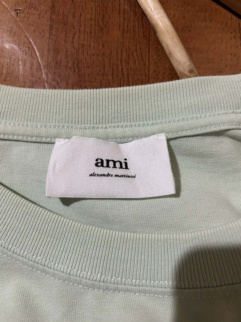 AMI Paris Green T-shirt (Category: Tshirts & Polo Shirts ) located in Bayombong. Submitted by hc_apparel0124 (Listing ID 1427095262, Image 2). Description: AUTHENTIC DIMES : 23 BY 27.5 COLOR RATE : 9.5/10 ISSUE : REPAIRED PINHOLES ( BACK LEFT SIDE ).