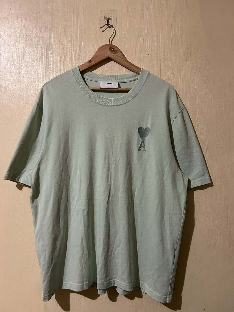 AMI Paris Green T-shirt (Category: Tshirts & Polo Shirts ) located in Bayombong. Submitted by hc_apparel0124 (Listing ID 1427095262, Image 1). Description: AUTHENTIC DIMES : 23 BY 27.5 COLOR RATE : 9.5/10 ISSUE : REPAIRED PINHOLES ( BACK LEFT SIDE ).