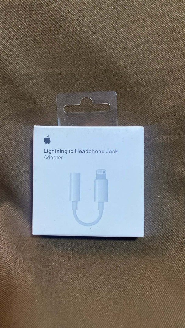 Apple Lightning to Headphone Jack Adapter (Category: Chargers & Cables) located in Manila. Submitted by pricious (Listing ID 1427093749, Image 1). Description: Lightning to Headphone Jack Adapter. This adapter allows you to connect your headphones with a 3.5mm jack to your iPhone or other devices with a Lightning port. It's a simple and effective solution for enjoying your music or taking calls with your favorite headphones. The adapter is in its