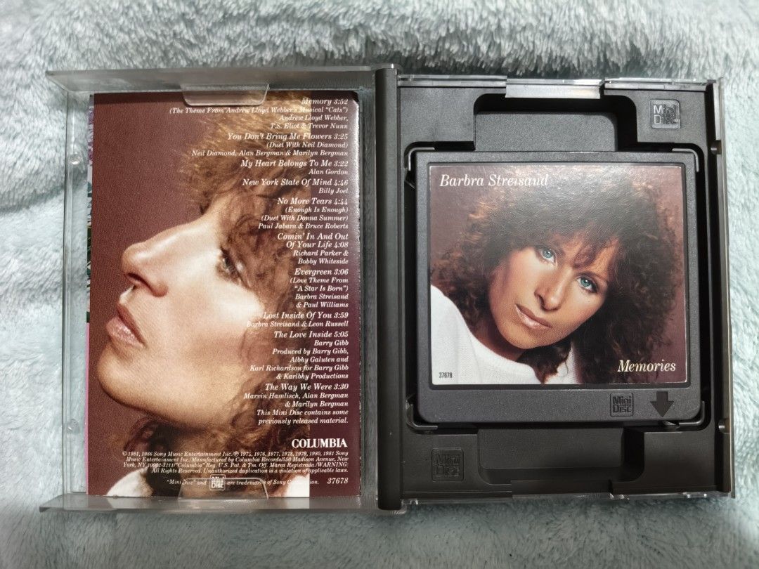 Barbra Streisand - Memories mini disc (Category: CDs & DVDs) located in Pateros City. Submitted by randomsheesh (Listing ID 1426970648, Image 2). Description: Selling my pre-loved Barbra Streisand "Memories" compilation album on Mini Disc format NM condition.Perfect para sa mga naghahanap ng classic vocal pop at easy listening tracks ni Barbra. Details: Format: Mini Disc Genre: Pop / Vocal / Easy Listening Artist: Barbra Streisand Tracklist Highl