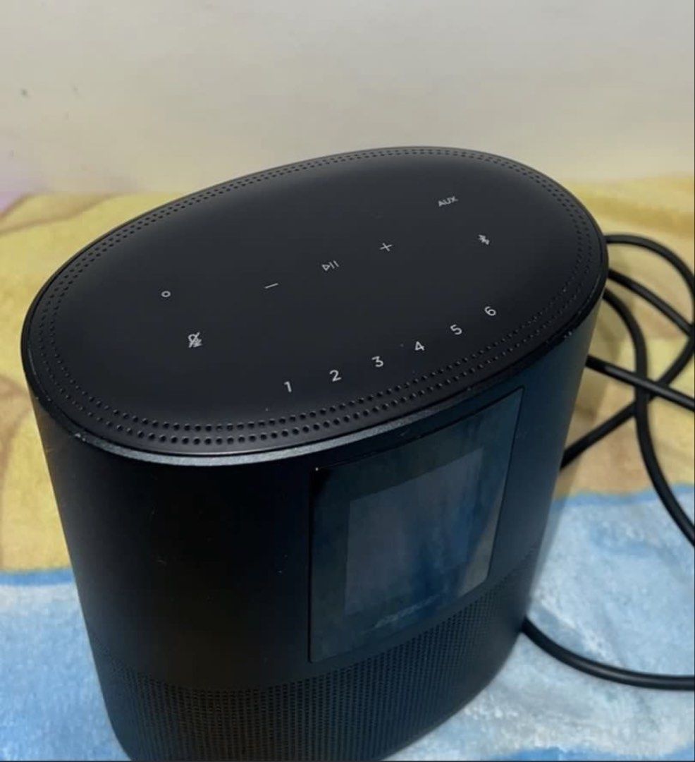 Bose Home Speaker 500 (Category: Soundbars, Speakers & Amplifiers) located in Mandaluyong City. Submitted by magnus323 (Listing ID 1427033274, Image 2). Description: Bose Home Speaker 500 in black. Features a built-in display and control buttons on top. Includes a power cable. The speaker has a cylindrical design with a perforated lower section. The Bose logo is visible on the front. No box, speaker and cable only. Bought brand new at P24,900. Th