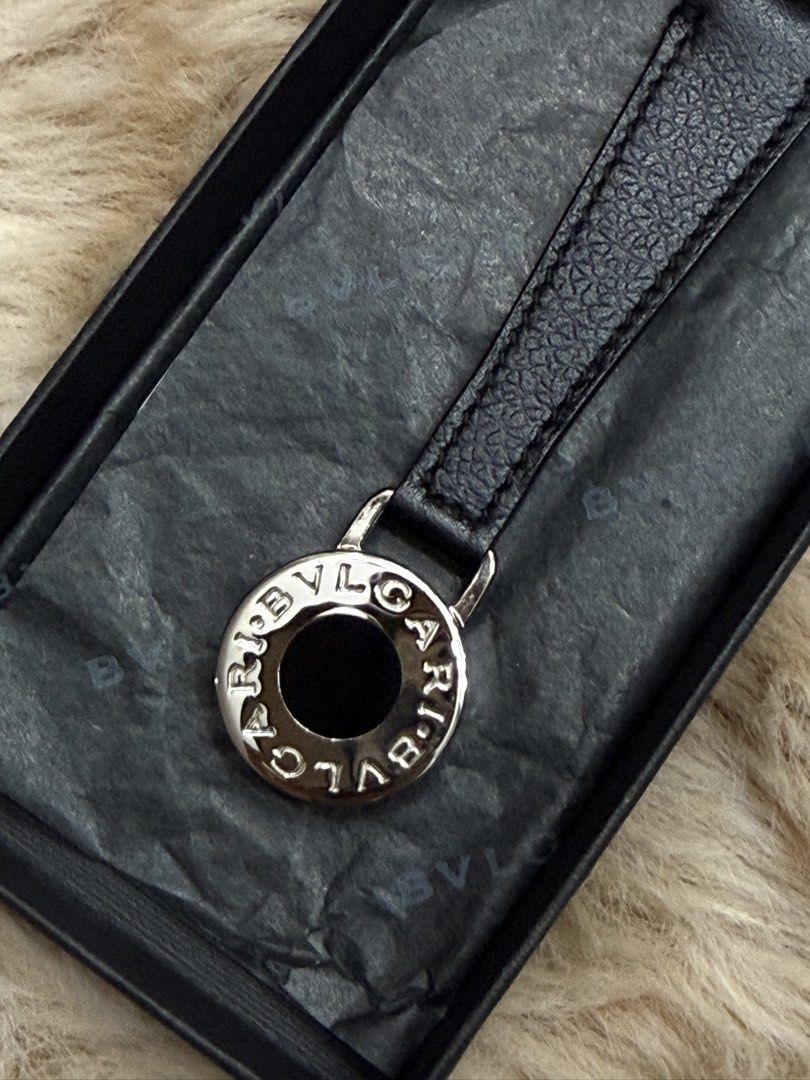 Bvlgari (Category: Luxury Accessories) located in Quezon City. Submitted by liezl.marie (Listing ID 1427082197, Image 3). Description: Bvlg@r! Key Holder a black leather strap and a sterling silver ring engraved with the brand’s iconic logo. - Unused 5500 Open for layaway. Disclaimer: We are not affiliated, associated, authorized, endorsed by or in any way officially connected with any other company or luxury brand. All copyrights are reserved to