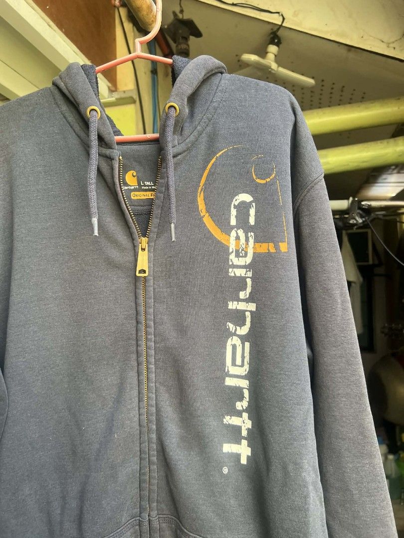 Carhartt bigscript hoodie (Category: Coats, Jackets and Outerwear) located in Cabuyao City. Submitted by ruster07 (Listing ID 1426972405, Image 2). Description: Carhartt bigscript hoodie Navy blue color Size L Tall on tag 24x31 dimes Made in Mexico ISSUE: faded, pinholes and paintstains sa sleeves J&T courier Loc: Butong Cabuyao City Laguna Meetup: Shell Cabuyao highway near Cabuyao Municipal Hall..