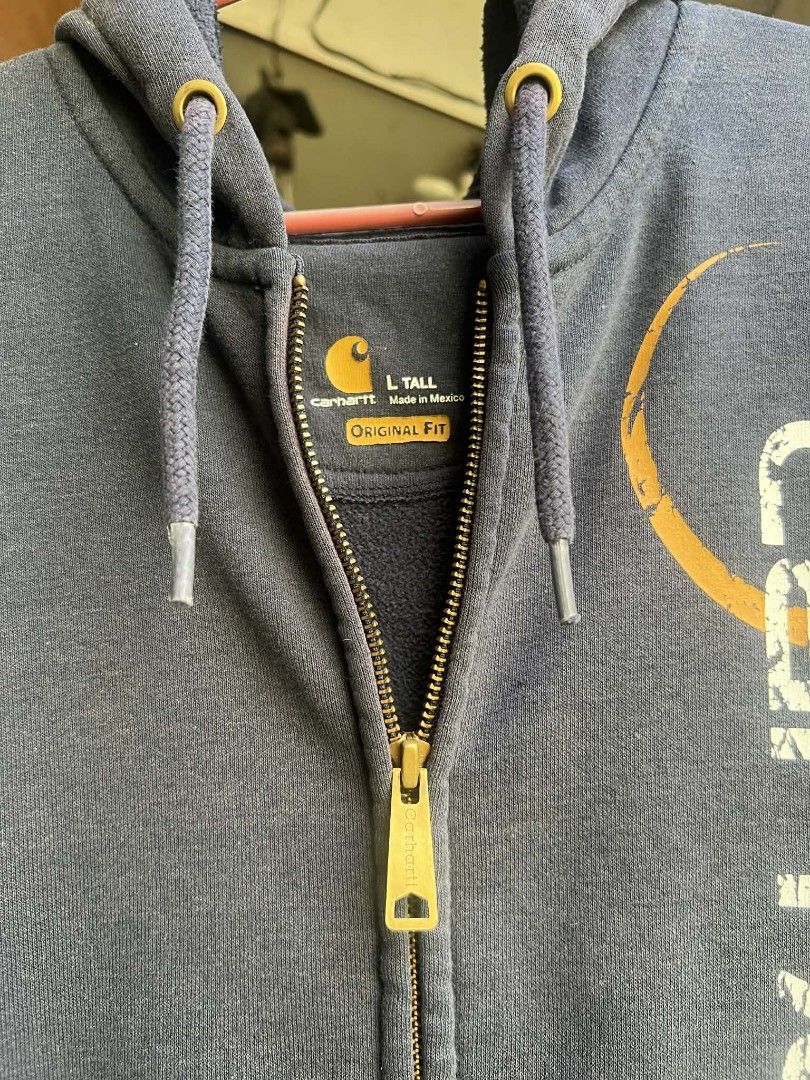 Carhartt bigscript hoodie (Category: Coats, Jackets and Outerwear) located in Cabuyao City. Submitted by ruster07 (Listing ID 1426972405, Image 3). Description: Carhartt bigscript hoodie Navy blue color Size L Tall on tag 24x31 dimes Made in Mexico ISSUE: faded, pinholes and paintstains sa sleeves J&T courier Loc: Butong Cabuyao City Laguna Meetup: Shell Cabuyao highway near Cabuyao Municipal Hall..