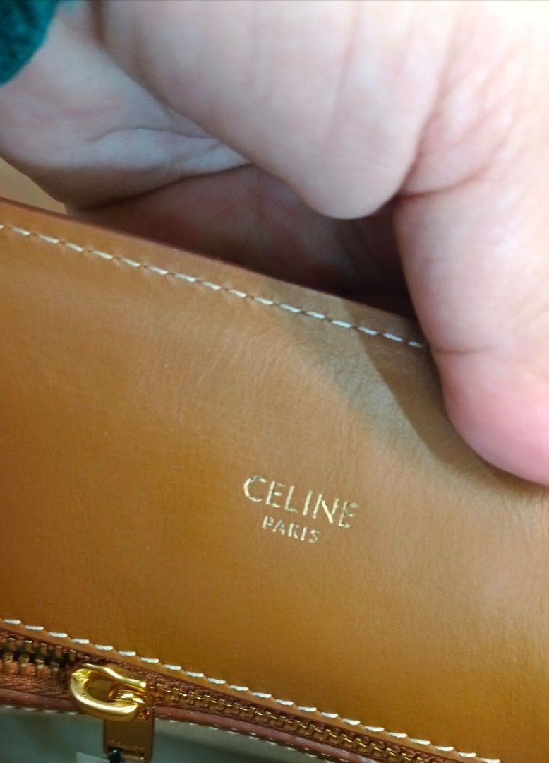 Celine Tote Bag (Category: Luxury Bags & Wallets) located in Legazpi City. Submitted by georgepineda791 (Listing ID 1427089199, Image 3). Description: Celine tote bag with a monogram pattern. Features a top handle and a detachable shoulder strap. The bag has a brown leather trim and a beige canvas body. The interior is lined with leather and includes the Celine Paris logo. The bag has a rectangular shape..