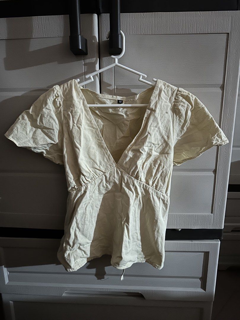 Cream-colored V-neck Top from Basic fits Clothing (Margaux) (Category: Sleeveless) located in Aroroy. Submitted by nicadeclutterz (Listing ID 1426974160, Image 3). Description: - got this from tiktok shop -only used once -color may appear lighter or darker due to lighting - dm for details ☺️ bustlines: 34-37 inches best fit wasitline: 26-31 .