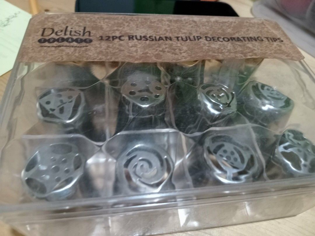 Delish 12-Piece Russian Tulip Decorating Tips original (Category: Cookware & Accessories) located in Pasig City. Submitted by mmrivera (Listing ID 1426960931, Image 2). Description: Delish 12pcs. russian pipping tip original last price po sa 800 pure stainless box box rfs; hindi na po nagagamit lalamove / lbc is our service couriers We deliver nationwide Luzon - lalamove and via bus Visayas - via bus and shipping lines Mindanao - via courier and 