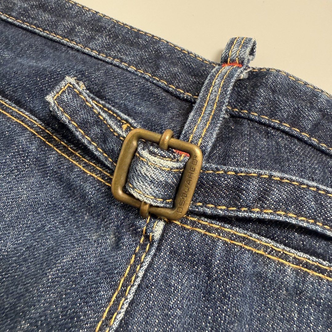 Dsquared2 Jeans Cinch back (Category: Jeans) located in Cebu City. Submitted by inukaybyjlf (Listing ID 1427031451, Image 3). Description: Actual measurements are shown in the photos. Authentic Dsquared2 jeans in size 44. Features a unique buckle detail on the back and a leather patch. Made in Italy. The jeans have a classic five-pocket design with a zip fly. The stitching is a mix of yellow and red. The jeans have a straight leg cut..