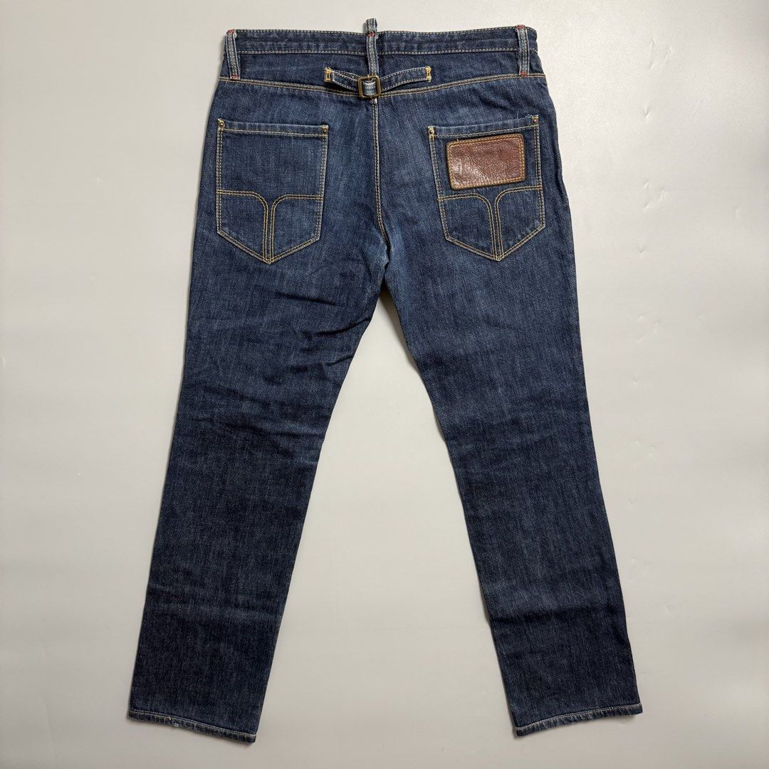 Dsquared2 Jeans Cinch back (Category: Jeans) located in Cebu City. Submitted by inukaybyjlf (Listing ID 1427031451, Image 1). Description: Actual measurements are shown in the photos. Authentic Dsquared2 jeans in size 44. Features a unique buckle detail on the back and a leather patch. Made in Italy. The jeans have a classic five-pocket design with a zip fly. The stitching is a mix of yellow and red. The jeans have a straight leg cut..