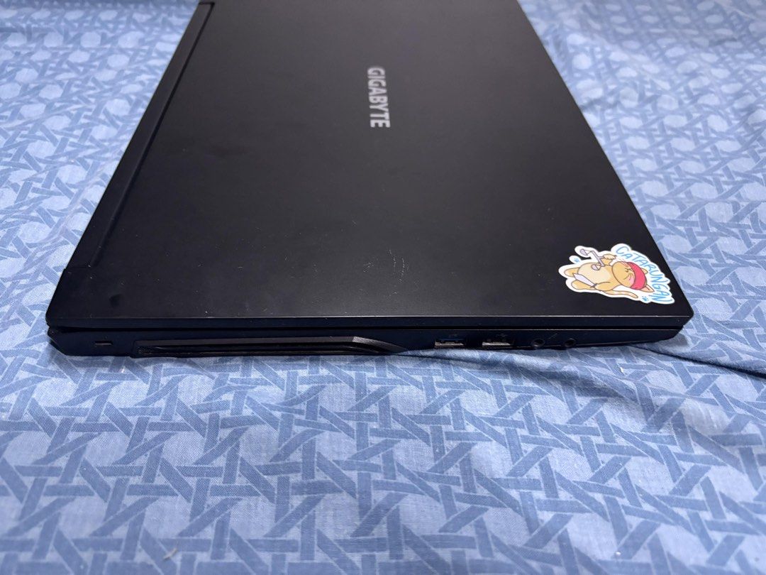 Gigabyte G5 GD Gaming Laptop (Category: Laptops & Notebooks) located in Taguig. Submitted by _ercmaeee (Listing ID 1427024960, Image 3). Description: For Sale Gigabyte G5 GD (Bought last September 2022) Specs: Display Size: 15.6 in Max Refresh Rate: 144 Hz CPU: i5-11400H RAM: 16 GB 3200 MHz (Upgradable up to 64 GB) GPU: RTX 3050 (4 GB) Storage: ADATA Legend 710 512 GB SSD Side Notes: - Yearly repasting and cleaning - Issues in paint chipping left